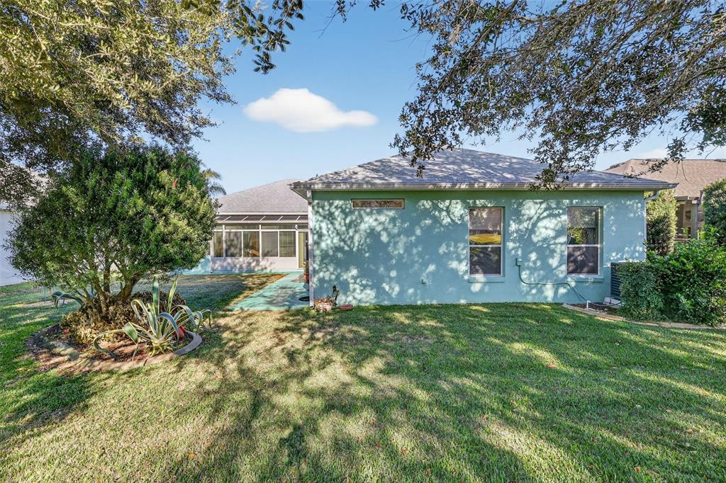 25517 Laurel Valley Road Leesburg, FL 34748 - Photo 3 of 56 a view of a house with a yard and a tree