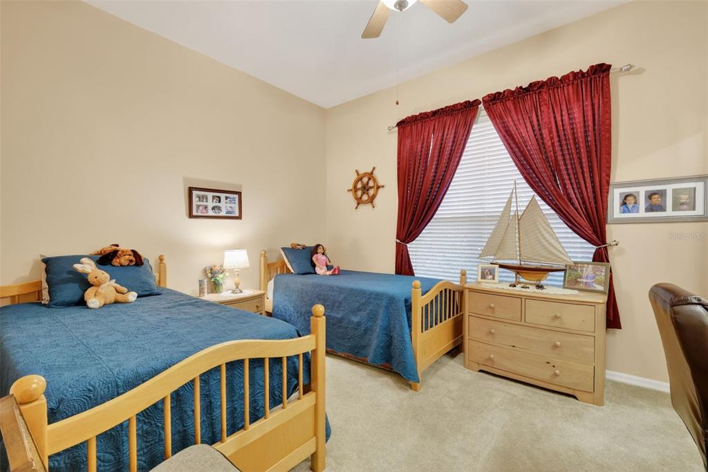 25517 Laurel Valley Road Leesburg, FL 34748 - Photo 35 of 56 a bedroom with furniture and a window