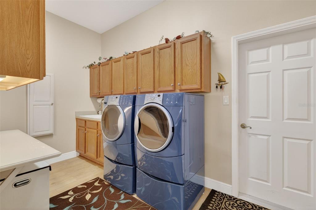 25517 Laurel Valley Road Leesburg, FL 34748 - Photo 36 of 56 a utility room with dryer and washer