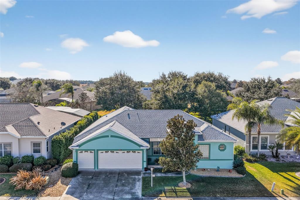25517 Laurel Valley Road Leesburg, FL 34748 - Photo 6 of 56 a view of house with garden space and a car park in front of it