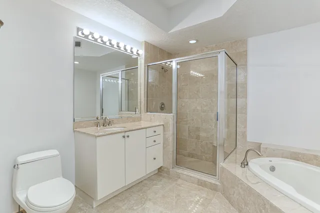 a bathroom with a bathtub a sink and a mirror
