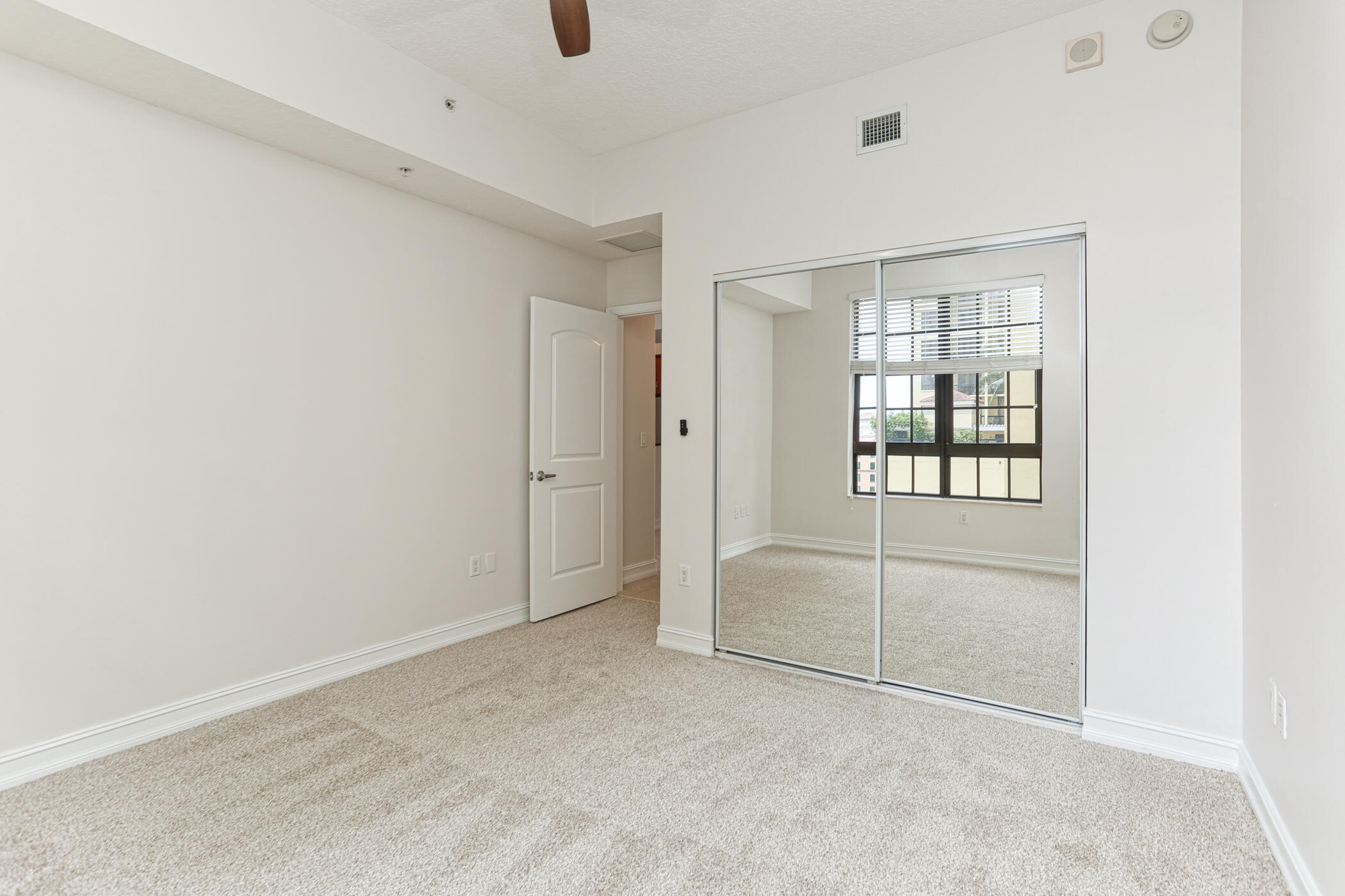 701 South Olive Avenue, Unit 603 West Palm Beach, FL 33401 - Photo 14 of 23 an empty room with windows