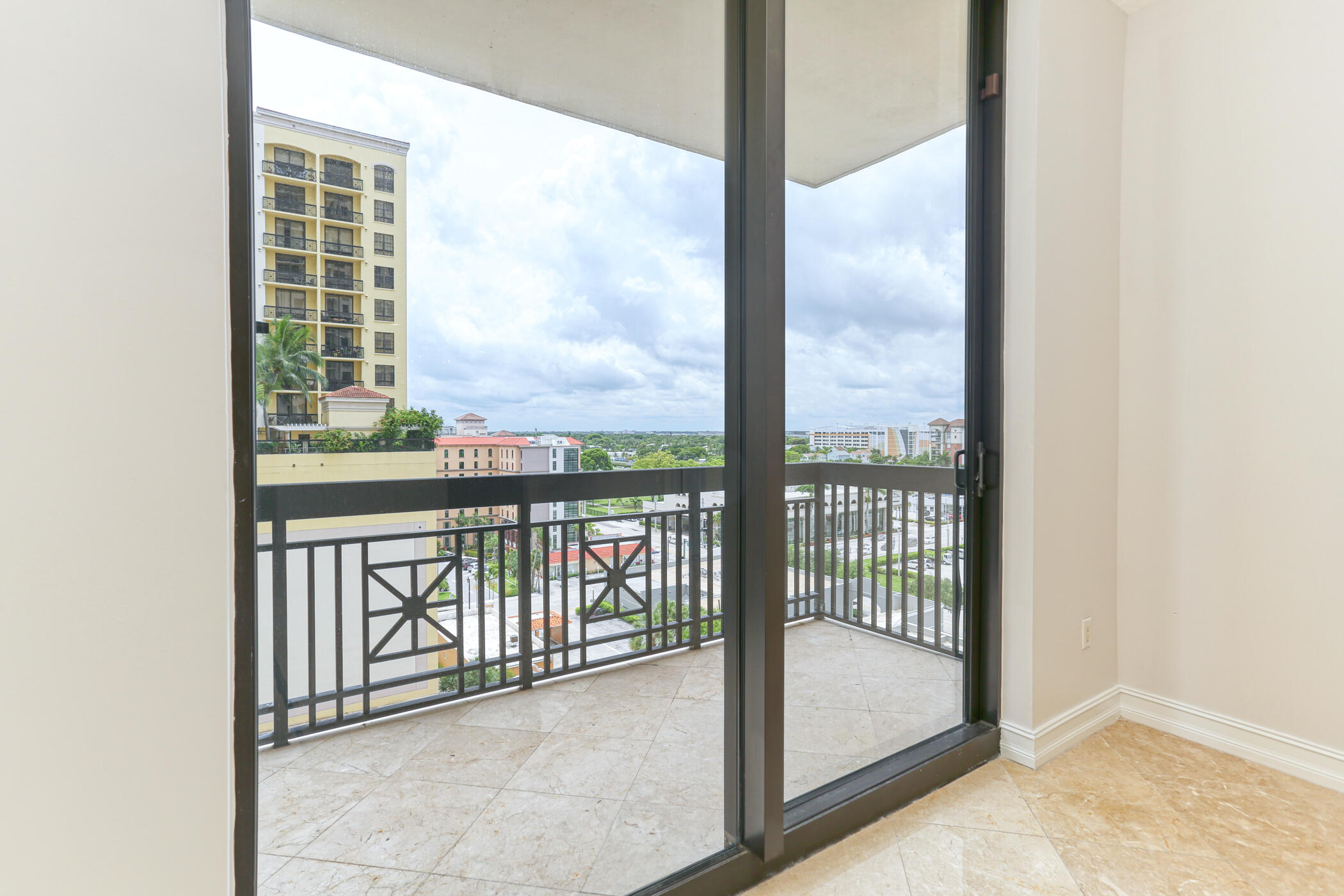 701 South Olive Avenue, Unit 603 West Palm Beach, FL 33401 - Photo 8 of 23 a view of a balcony with a floor to ceiling window