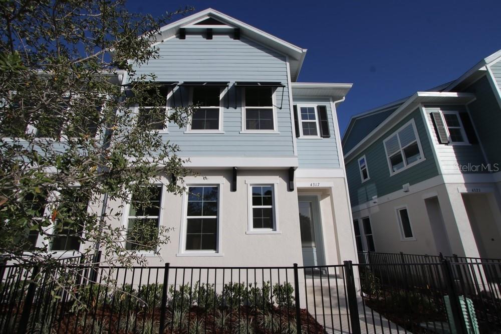 4317 Roush Avenue Orlando, FL 32803 - Photo 1 of 13 a front view of a house with a yard