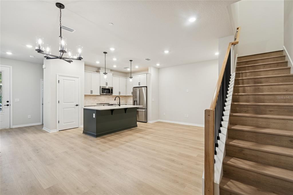 4317 Roush Avenue Orlando, FL 32803 - Photo 11 of 39 a view of kitchen with cabinets and wooden floor
