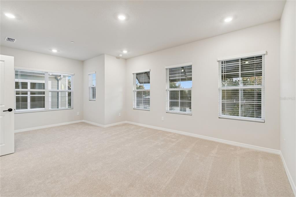 4317 Roush Avenue Orlando, FL 32803 - Photo 17 of 39 an empty room with windows
