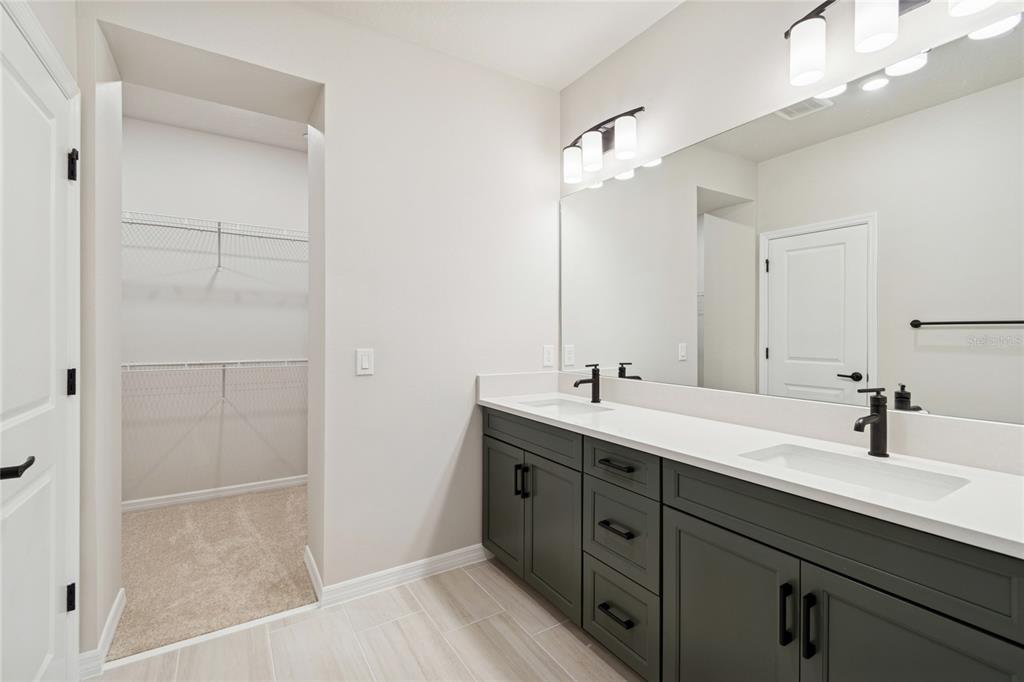 4317 Roush Avenue Orlando, FL 32803 - Photo 20 of 39 a bathroom with a double vanity sink a and mirror