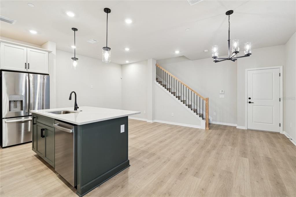 4317 Roush Avenue Orlando, FL 32803 - Photo 6 of 39 a kitchen that has a sink a stove and a refrigerator