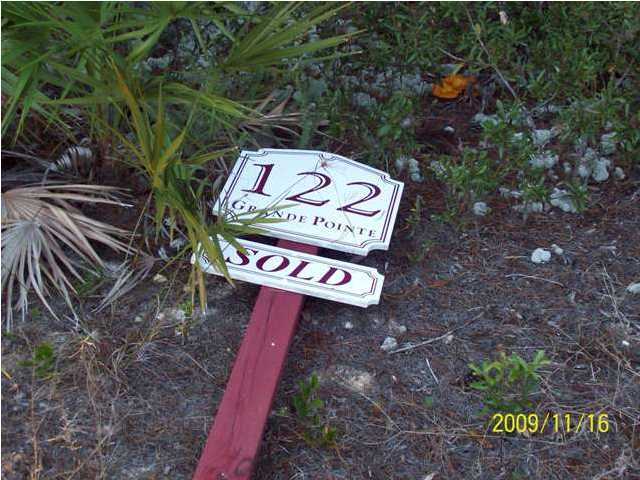 122 Grande Pointe Cir Inlet Beach Inlet Beach, FL 32461 - Photo 3 of 6 a sign that is on a brick wall