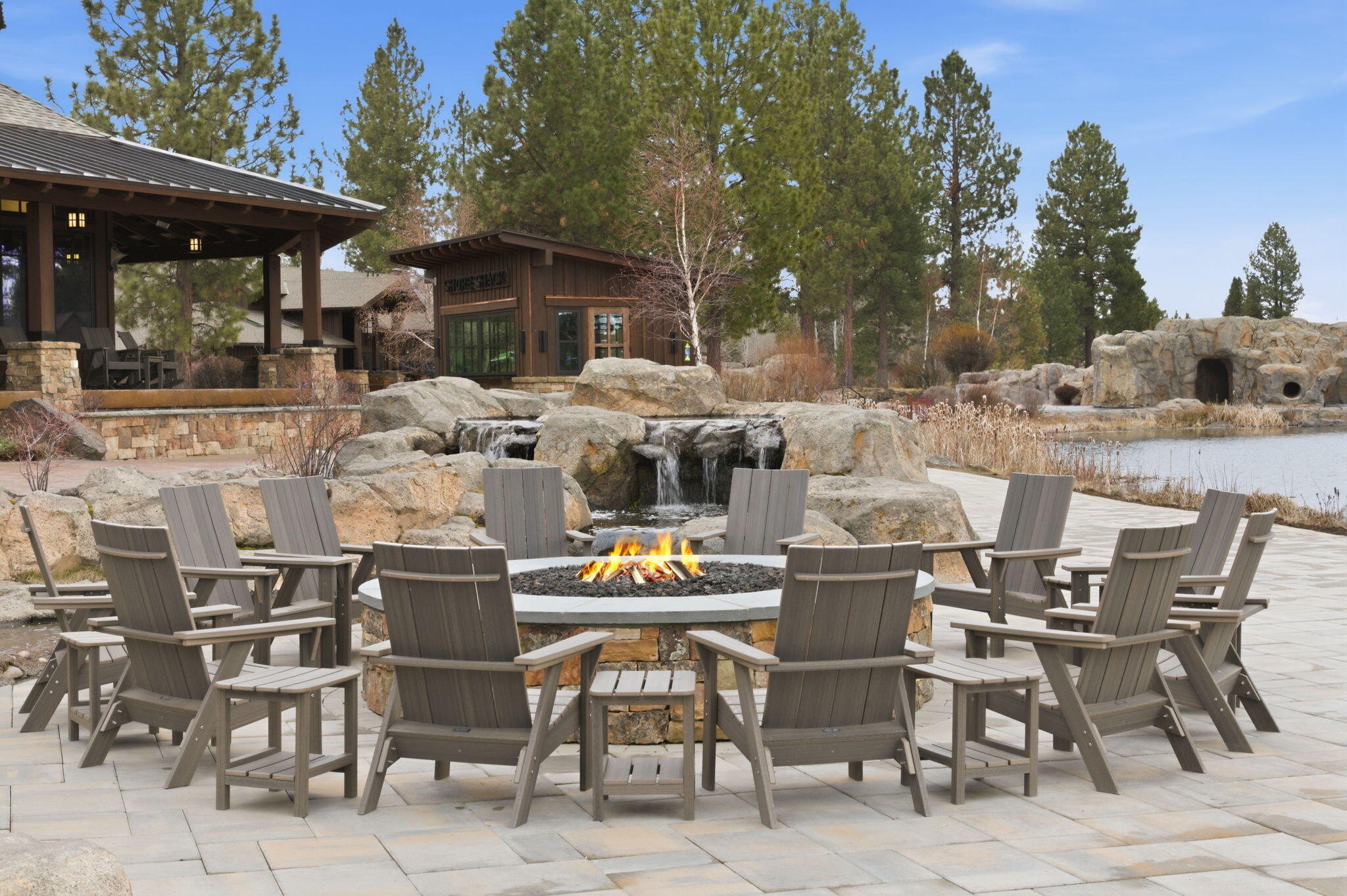 56508 Dancing Rock Loop, Unit 22 Bend, OR 97707 - Photo 58 of 69 a view of a patio with table and chairs and potted plants