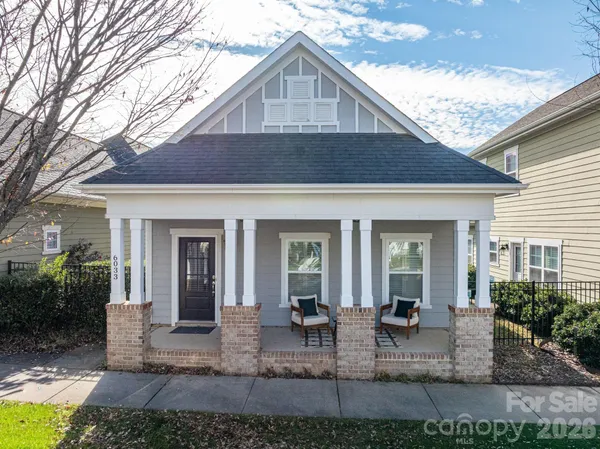 a view of house with outdoor seating space