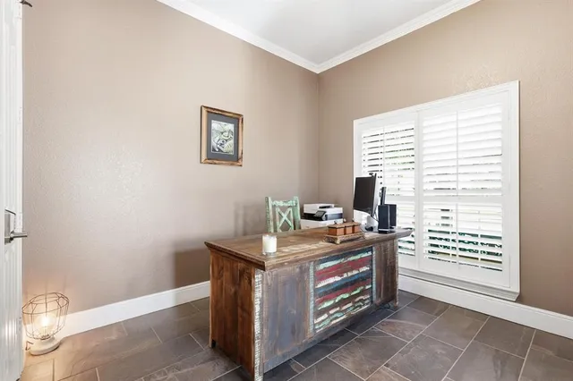 a spacious bedroom with a bed and a chandelier