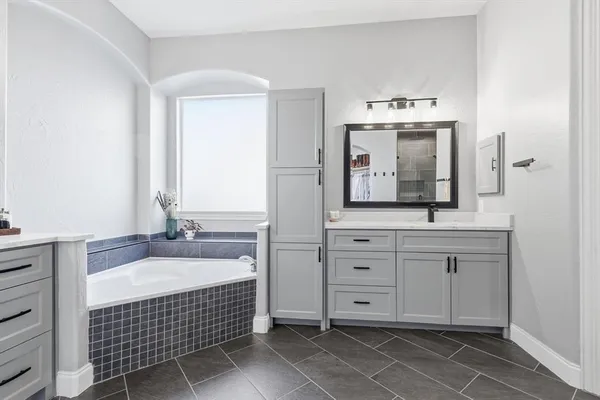a bathroom with a sink double vanity and a mirror