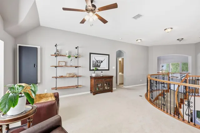 an aerial view of a house with a yard and lake view