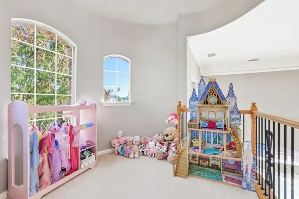 a bedroom with toys and a wooden floor
