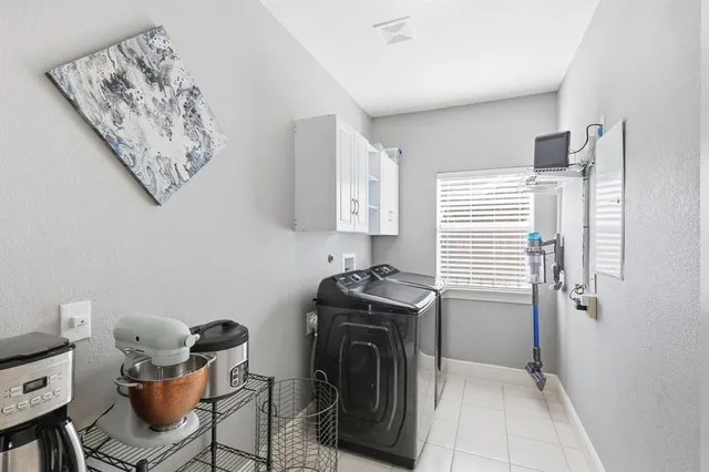 an aerial view of residential houses with outdoor space and swimming pool