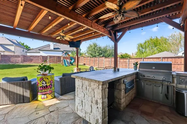 a view of an outdoor kitchen