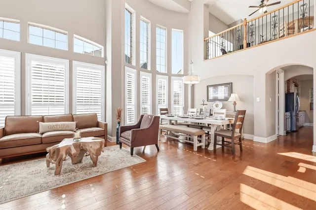 a view of a dining room with furniture wooden floor and chandelier