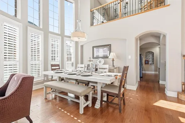 a view of a dining room with furniture window and wooden floor