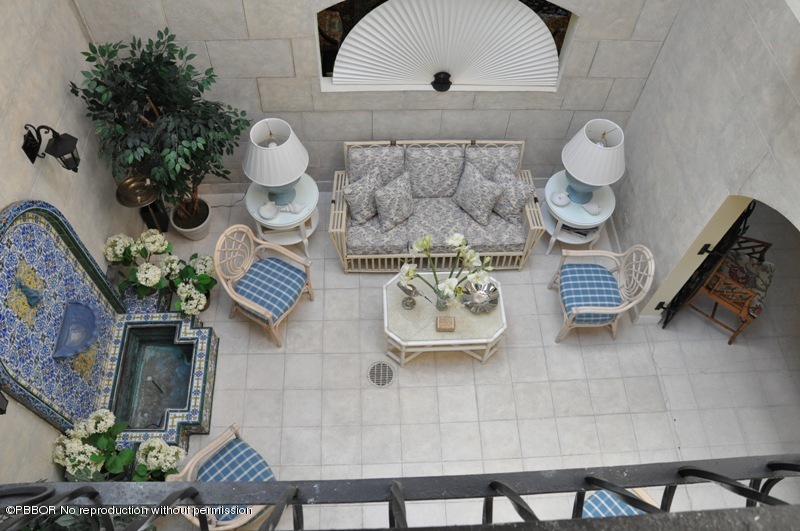 196 Valencia Road West Palm Beach, FL 33401 - Photo 17 of 25 Atrium view from Upstairs