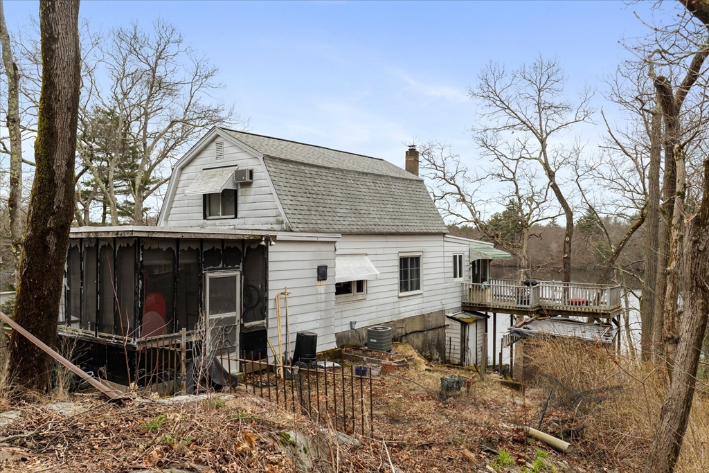30 Manitou Road Canton, MA 02021 - Photo 3 of 25 a view of a house with a yard covered in snow