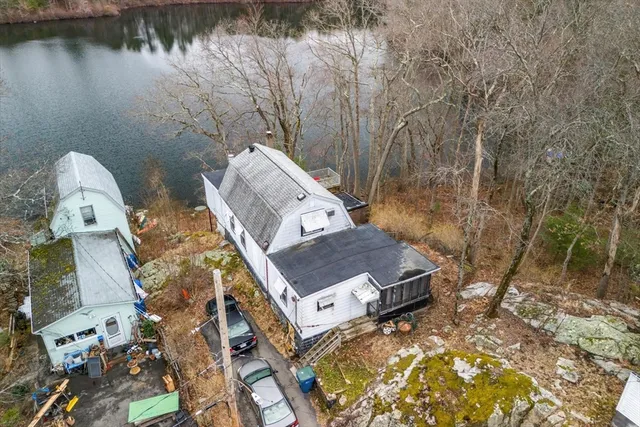 aerial view of a house with a yard