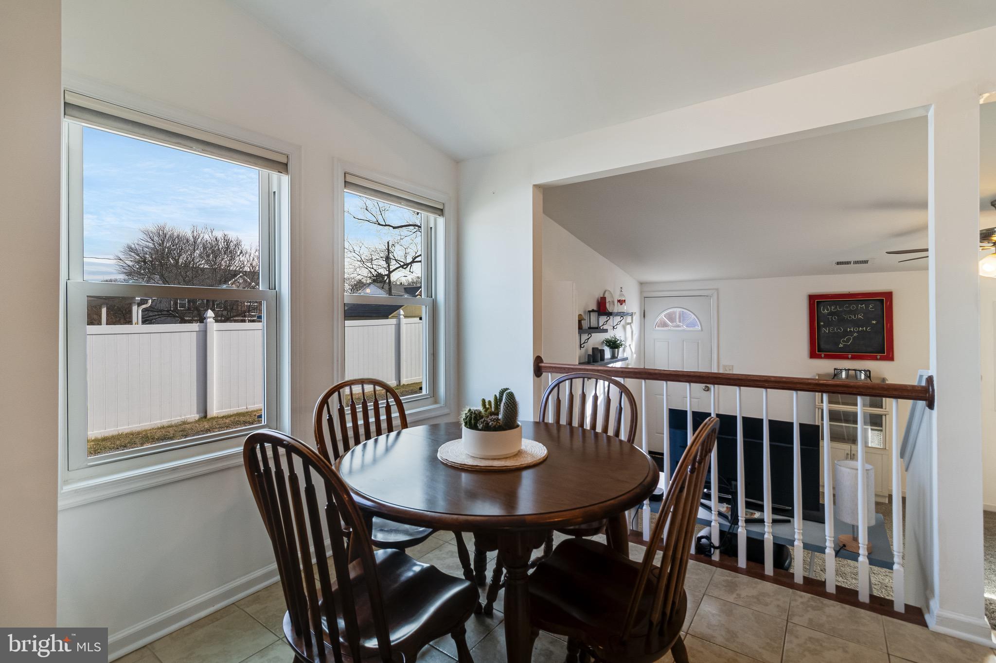 6905 East Clinton Street Clinton, MD 20735 - Photo 14 of 47 a view of a dining room with furniture window and wooden floor