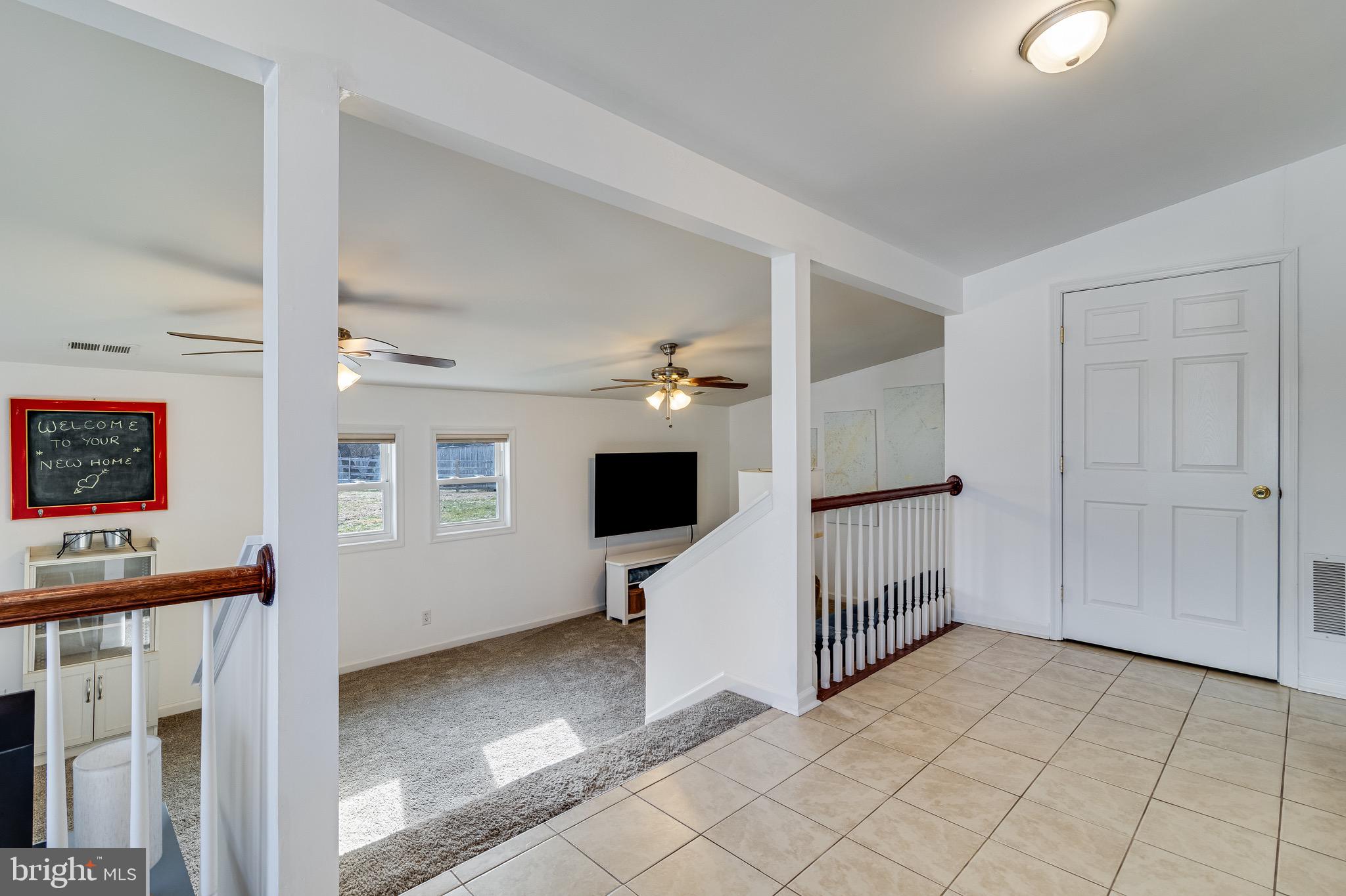 6905 East Clinton Street Clinton, MD 20735 - Photo 15 of 47 a view of a hallway with workspace and a window