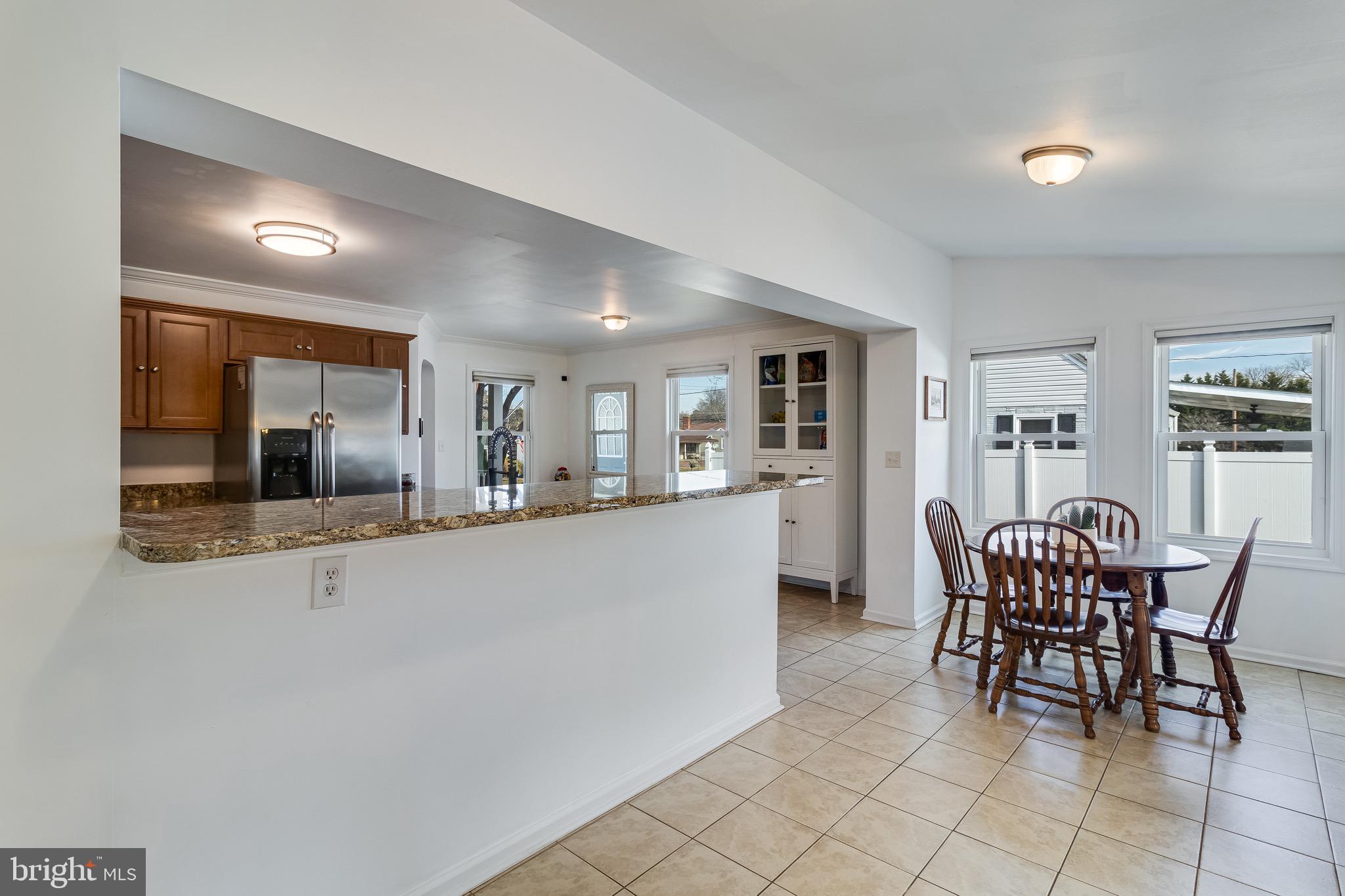 6905 East Clinton Street Clinton, MD 20735 - Photo 17 of 47 a dining room with furniture and window