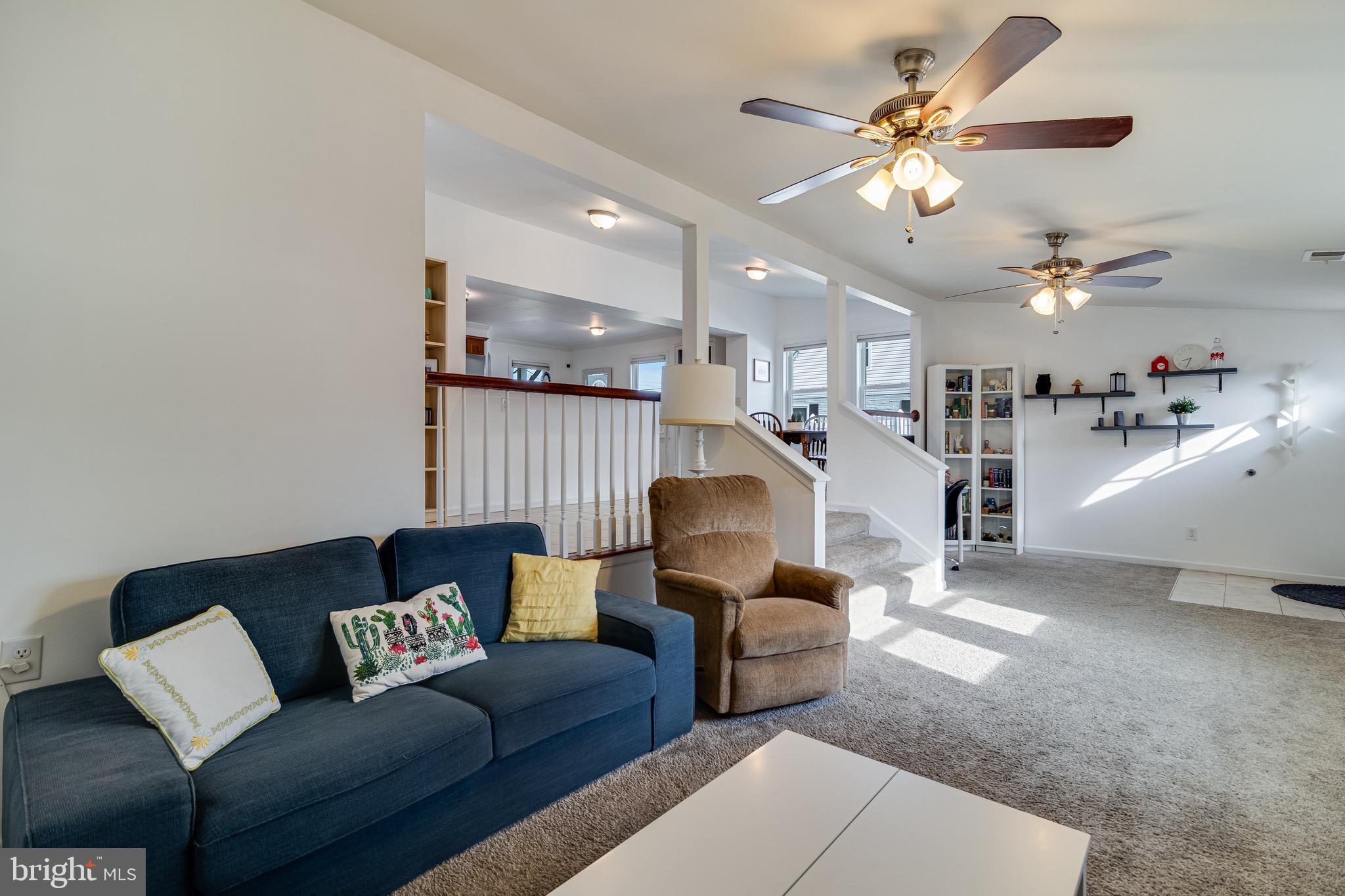 6905 East Clinton Street Clinton, MD 20735 - Photo 21 of 47 a living room with furniture and a chandelier