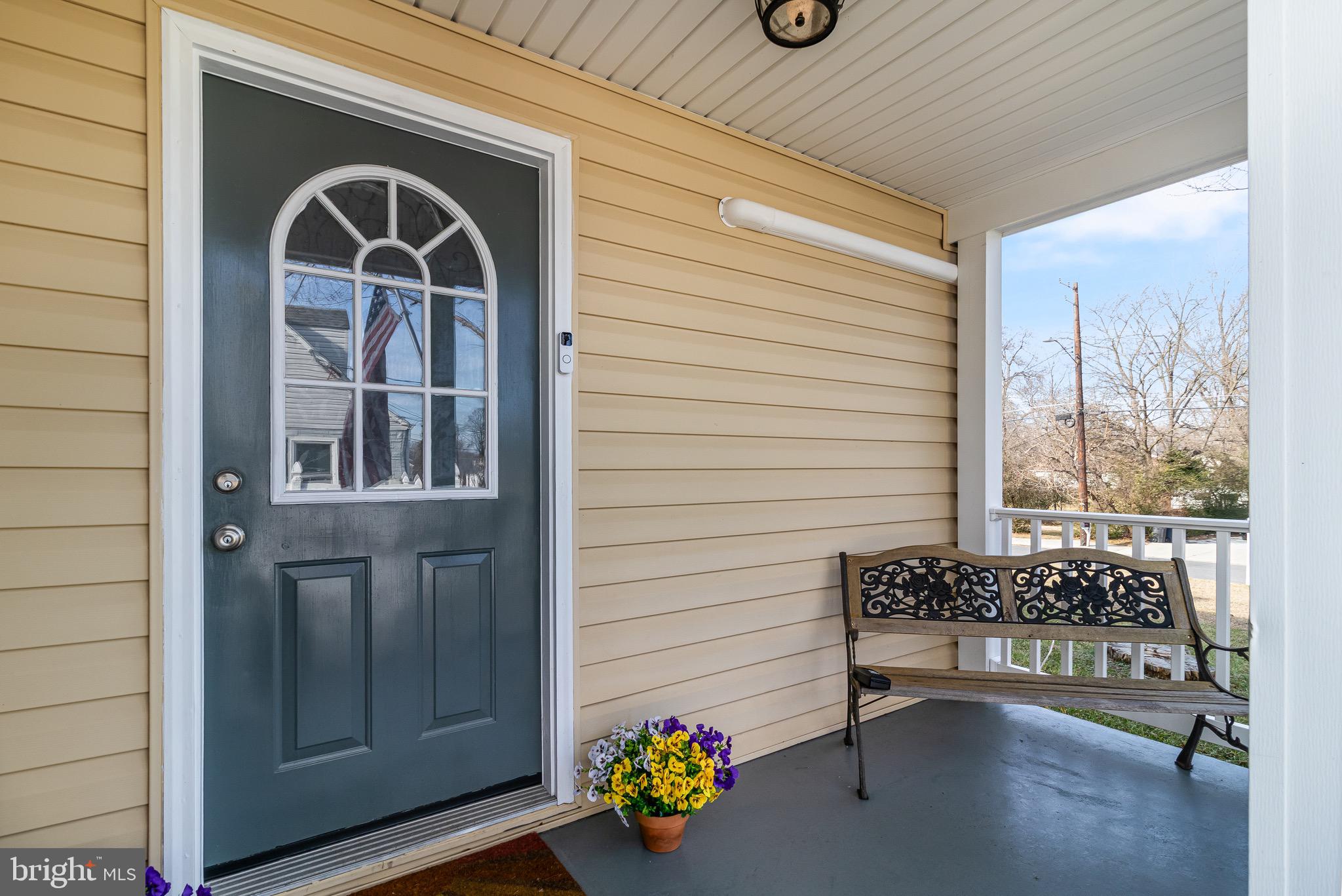6905 East Clinton Street Clinton, MD 20735 - Photo 3 of 47 a front view of a house with outdoor seating