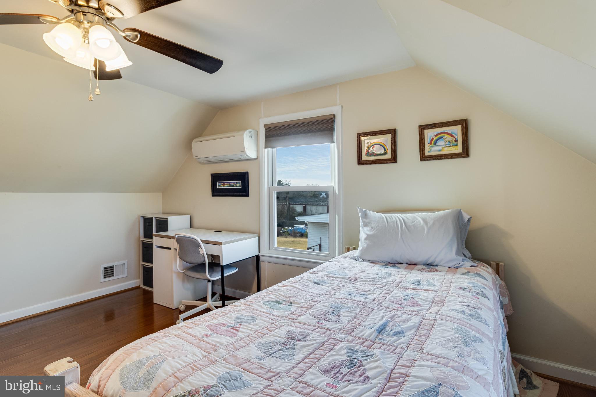 6905 East Clinton Street Clinton, MD 20735 - Photo 31 of 47 a bedroom with a bed and a table