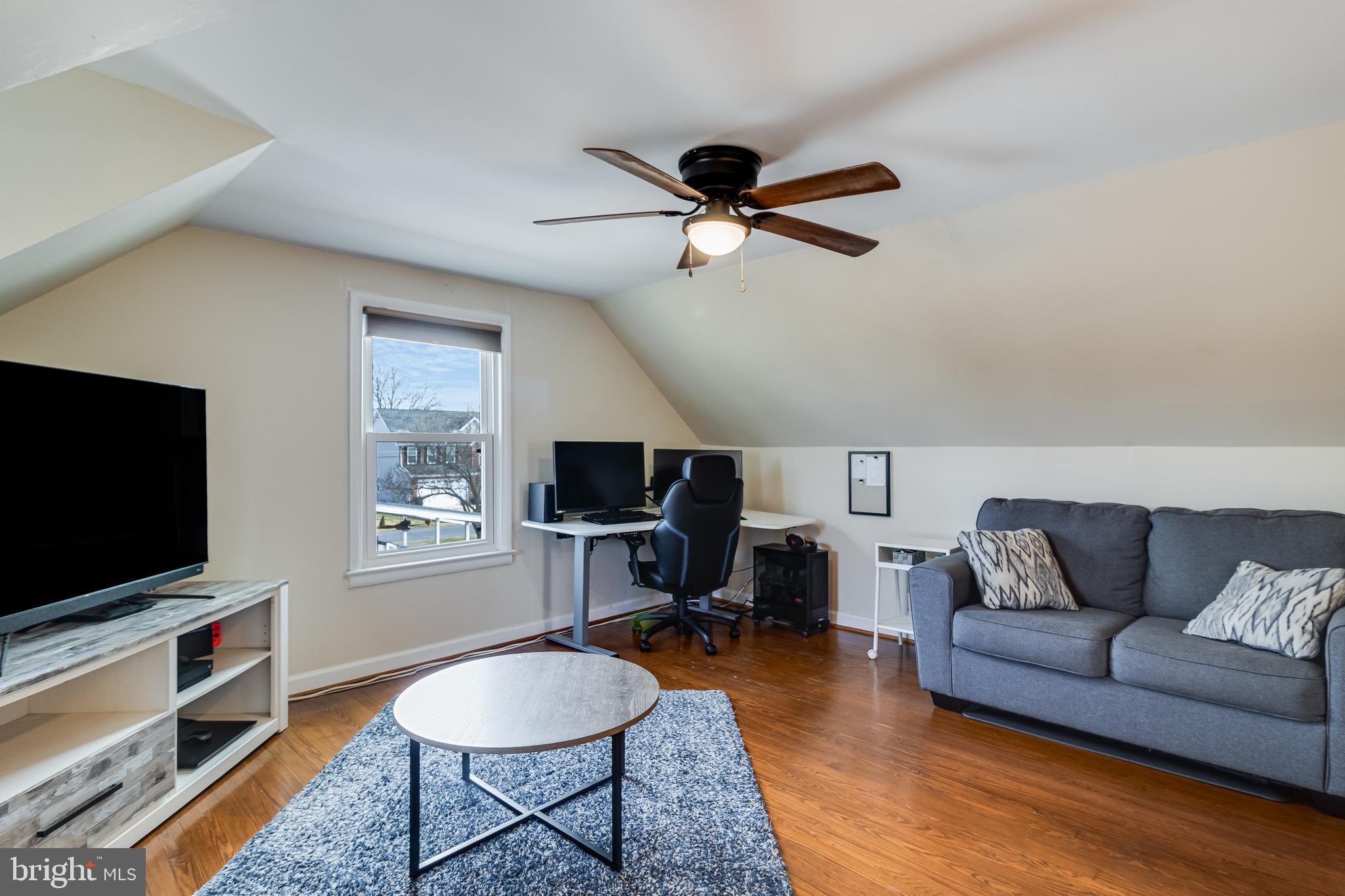 6905 East Clinton Street Clinton, MD 20735 - Photo 33 of 47 a living room with furniture and a flat screen tv