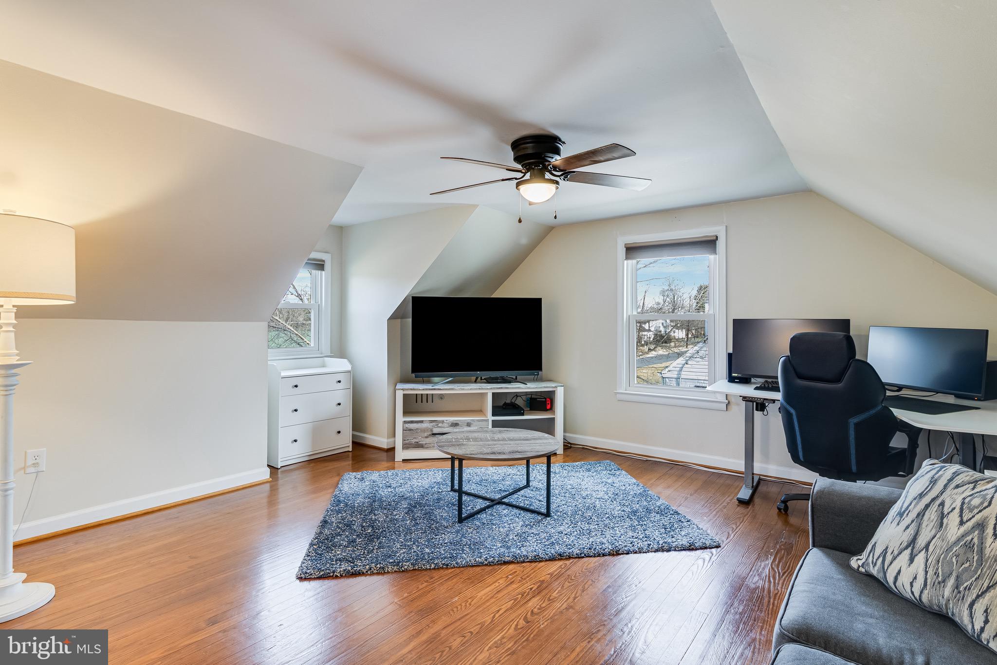 6905 East Clinton Street Clinton, MD 20735 - Photo 34 of 47 a living room with furniture and a flat screen tv