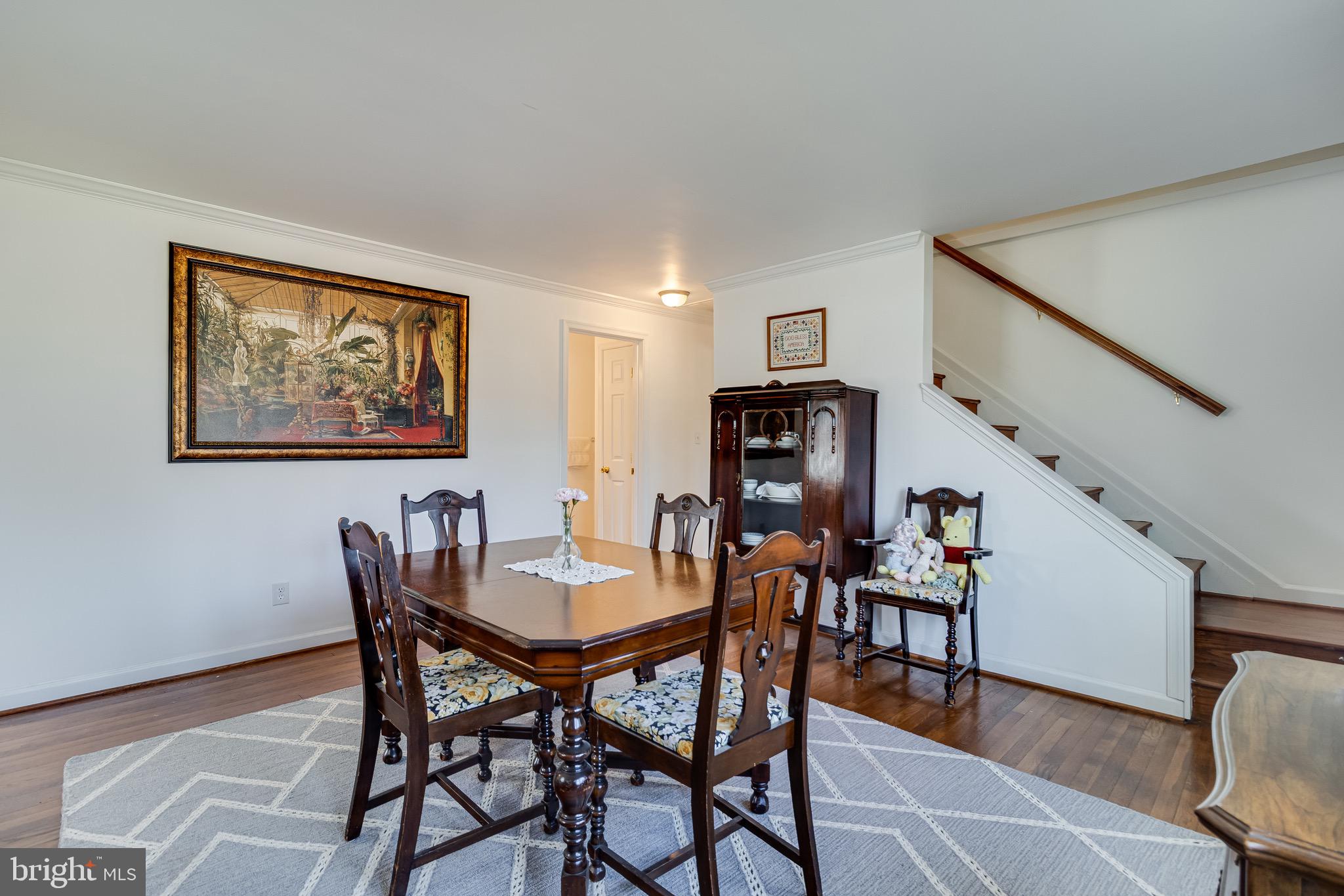 6905 East Clinton Street Clinton, MD 20735 - Photo 4 of 47 a view of a dining room with furniture and wooden floor