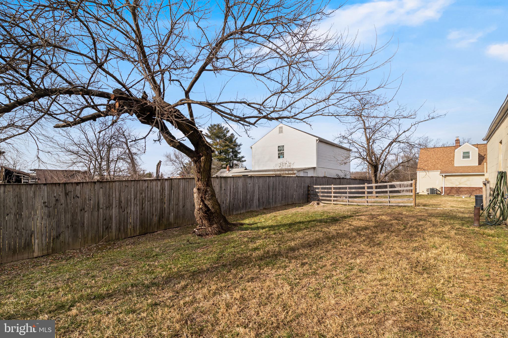 6905 East Clinton Street Clinton, MD 20735 - Photo 41 of 47 a view of backyard with wooden fence