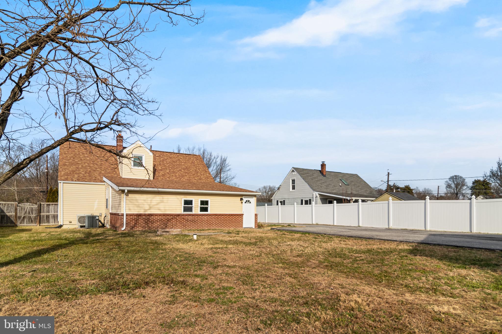 6905 East Clinton Street Clinton, MD 20735 - Photo 42 of 47 a front view of a house with a yard