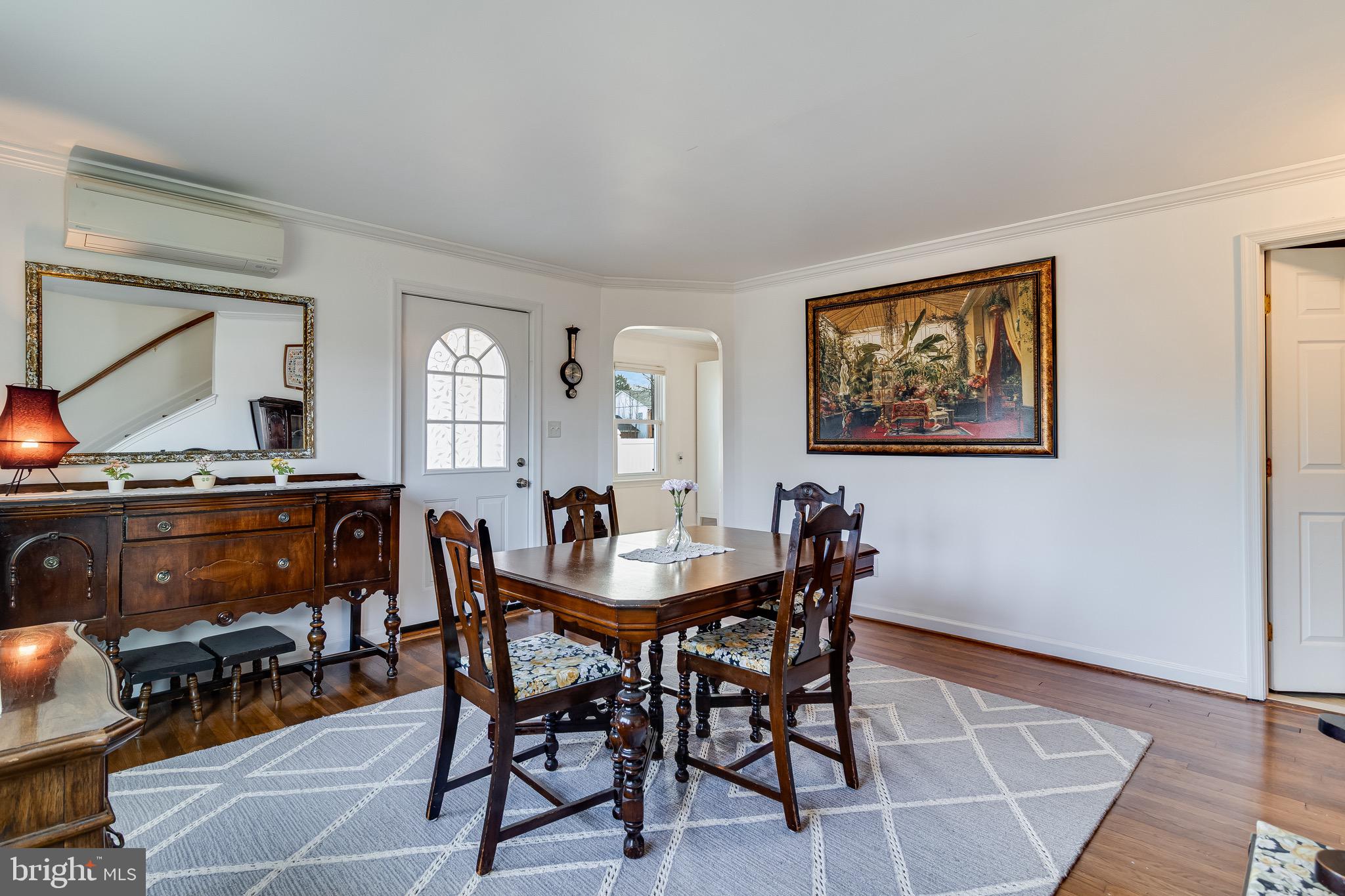 6905 East Clinton Street Clinton, MD 20735 - Photo 5 of 47 a view of a dining room with furniture and wooden floor