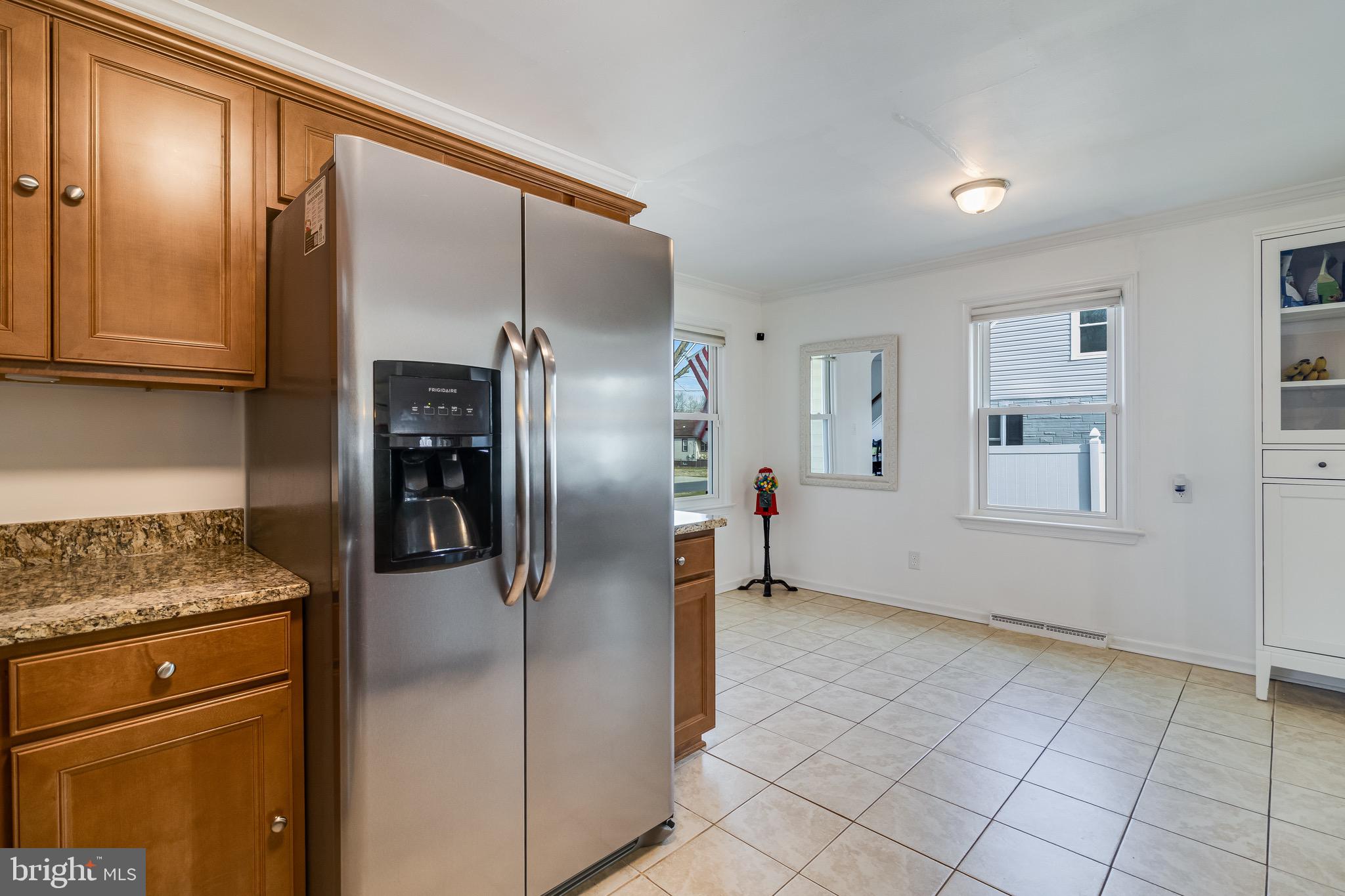6905 East Clinton Street Clinton, MD 20735 - Photo 10 of 47 a kitchen with a refrigerator and cabinet