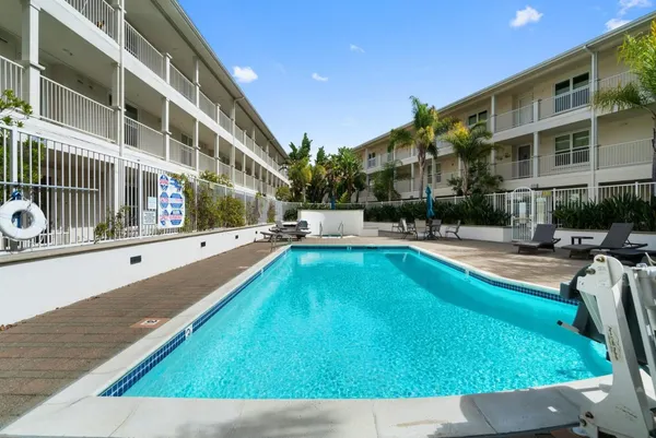 a view of swimming pool with a lounge chair