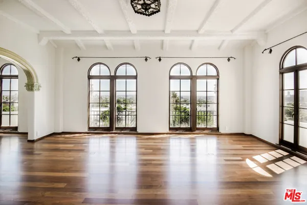 a view of an entryway with wooden floor