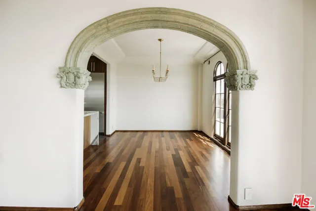 an entryway view with wooden floor