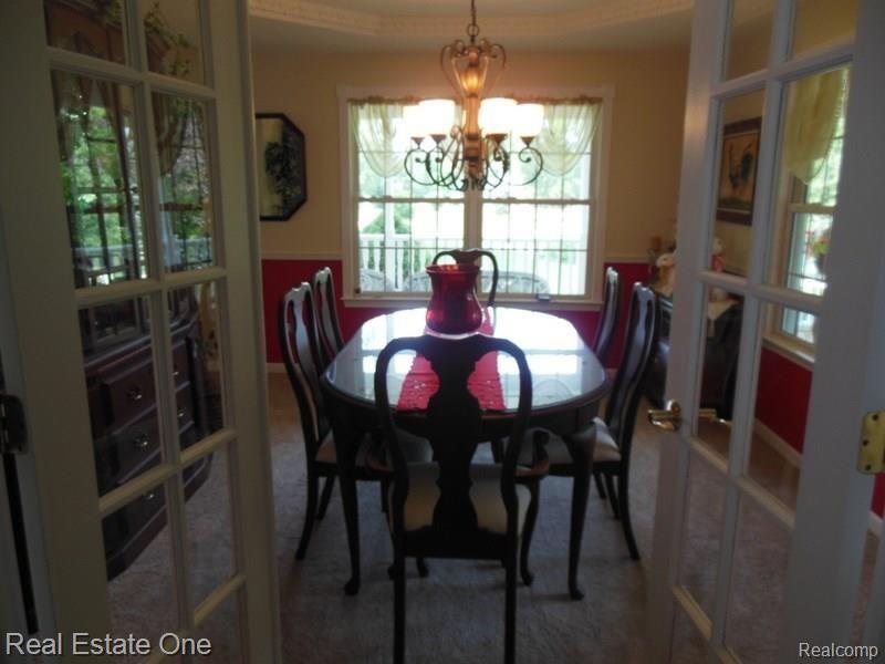 10155 Roberts Road Gregory, MI 48137 - Photo 14 of 89 Formal dining room, pan ceiling, chair rail, French doors.
