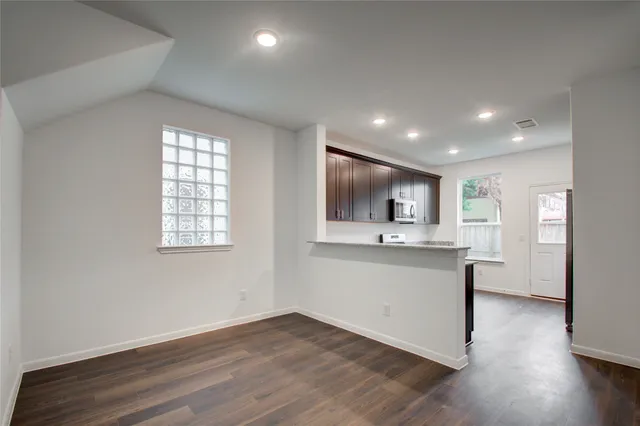 a view of kitchen with sink and wooden floor