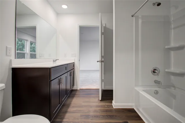 a bathroom with a bathtub sink and toilet