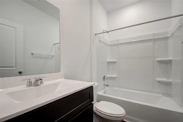 a bathroom with a sink a toilet and a bathtub