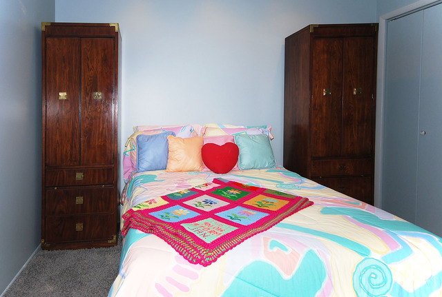 550 Greystone Lane, Unit A2 Wheeling, IL 60090 - Photo 12 of 23 a bedroom with a bed and a window