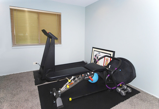 550 Greystone Lane, Unit A2 Wheeling, IL 60090 - Photo 13 of 23 a living room with furniture