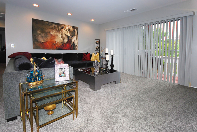 550 Greystone Lane, Unit A2 Wheeling, IL 60090 - Photo 3 of 23 a room with furniture and a flat screen tv