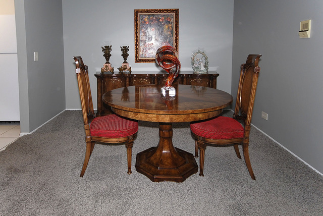 550 Greystone Lane, Unit A2 Wheeling, IL 60090 - Photo 4 of 23 a dining room with furniture and wooden floor